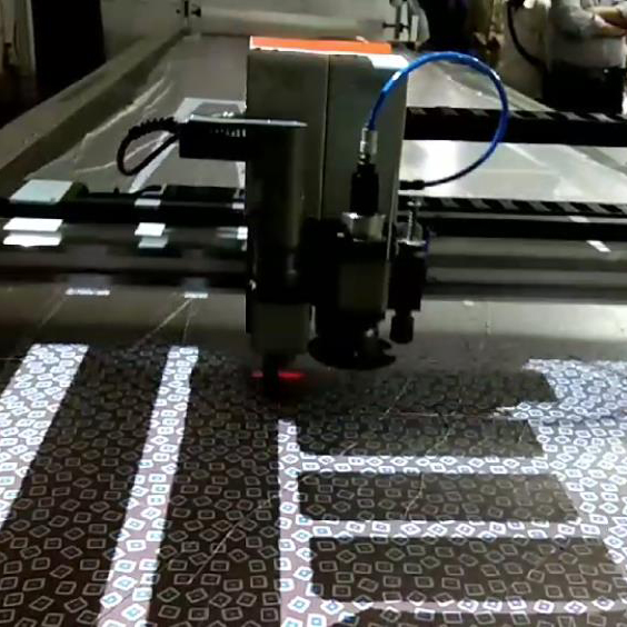 Projection based positioning fabric cutting video